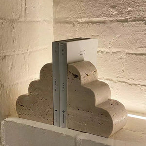 Travertine Stone Cloud Bookends on white painted brick wall with back light wall light and Paris city guides - Sumac Store