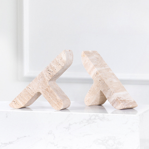 Open image in slideshow, Travertine Stone &#39;T&#39; Bookends - Sumac Store - white background on white granite stone table
