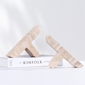 Travertine Stone 'T' Bookends on a book kinfolk enterprise white background